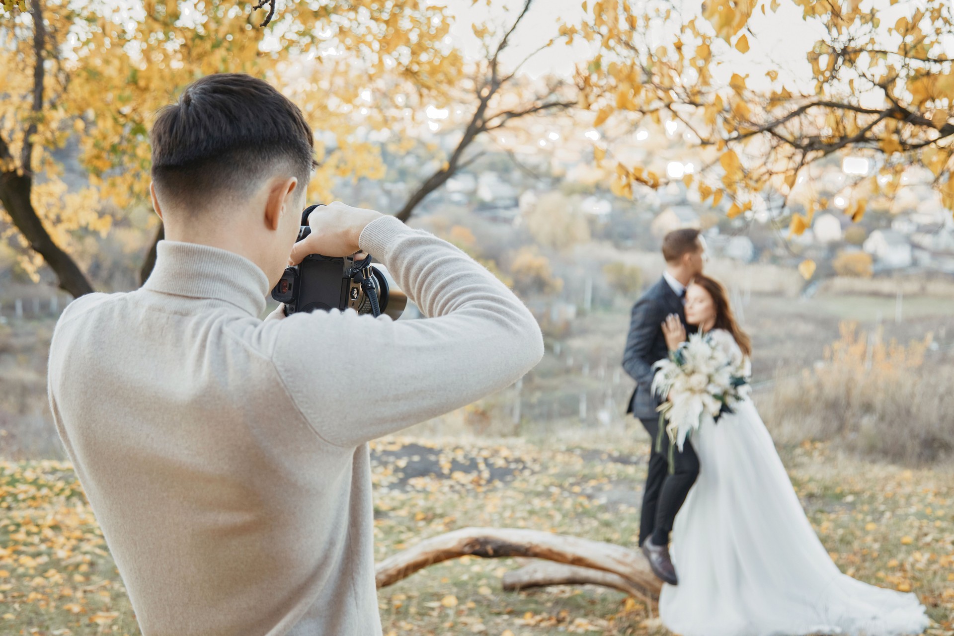 wedding photographer taking pictures of the bride and groom